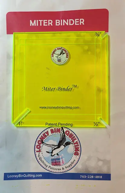 Miter Binder quilting tool: Yellow acrylic template for creating perfect mitered binding corners. Includes 1/2" and 1" measurements. - Looney Bin Quilting