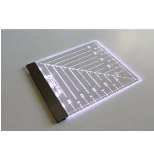 Glow Ruler 6" (Right-handed): Illuminated acrylic ruler with angled lines for precise cutting and measuring. - Looney Bin Quilting