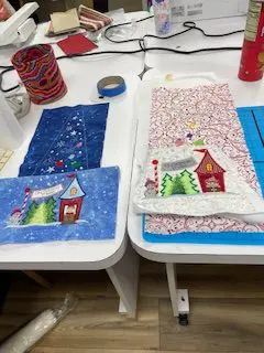 Designs by JuJu Christmas tree skirt: Handmade quilted tree skirt with embroidered winter village scene. - Looney Bin Quilting