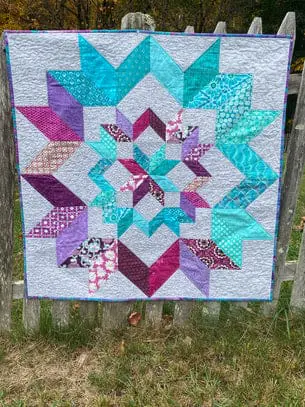 The Carpenter's Apprentice quilt: Colorful star pattern in teal, purple, and pink fabrics - Looney Bin Quilting
