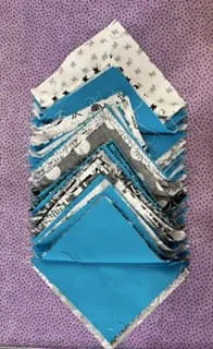 Stack of fabric squares in turquoise, white, grey, and black patterns for quilting – Looney Bin Quilting Stack of fabric squares in turquoise, white, grey, and black patterns for quilting - Looney Bin Quilting
