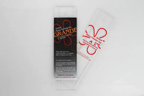 A packet of grande in black with white background